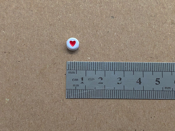 Corazón, Beads